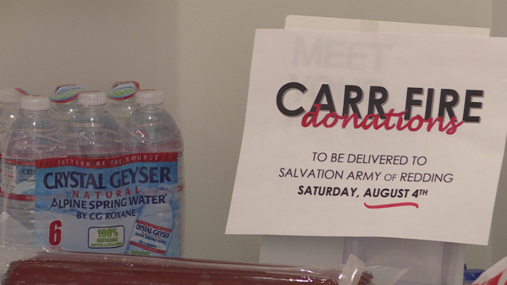 Community members taking donations for fire victims from the Carr Fire